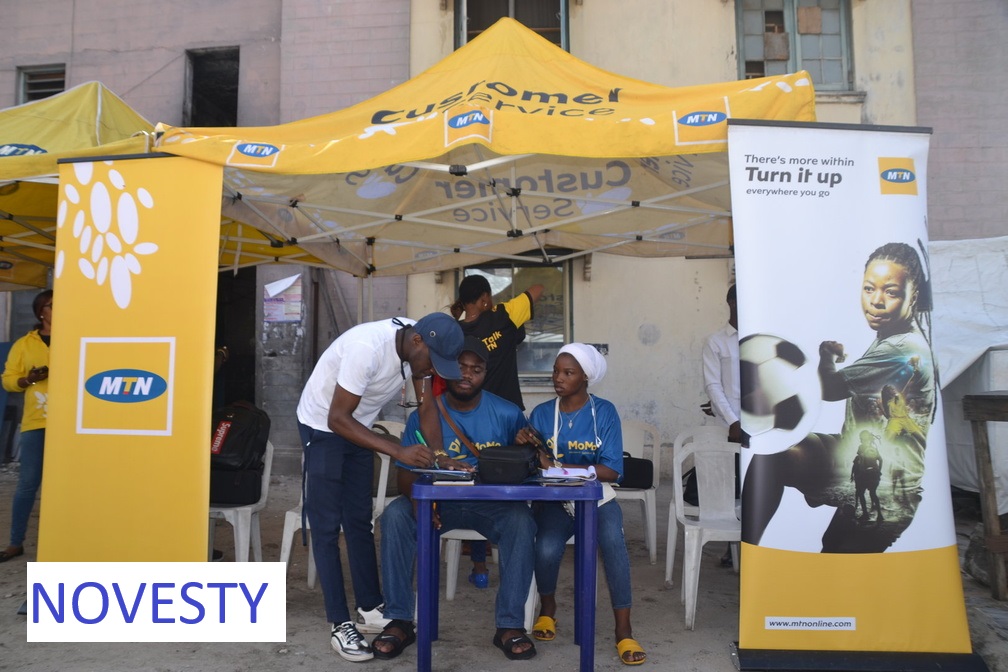 Become a MoMo Agent - MoMo agent serving customers at their business location